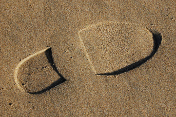 Footstep in sand on beach