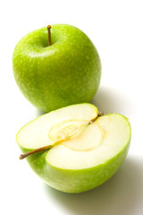 The ripe juicy green apples. Isolation on white.