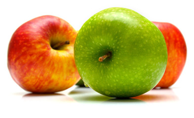 Red and green apples on the white background. Isolated.