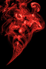 Obraz premium Red smoke on black background