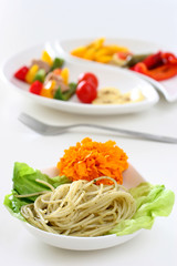 Pasta olio with edible flower and lettuce
