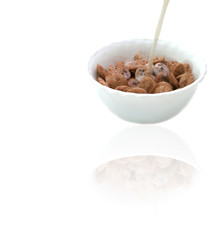 Bowl of cereals and milk isolated on white.