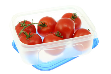 Plastic lunch box with tomatoes.
