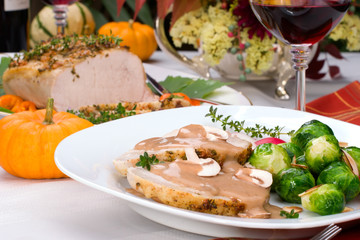 Delicious sliced garlic thyme roast pork loin with mushrooms