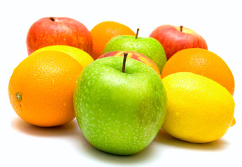 Allsort from several fruits covered by water drops on a white.