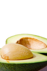 A shot of a halfed avocado isolated on white