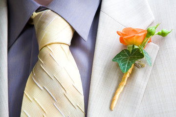 Orange Rose Wedding Boutonniere On Suit of Groom