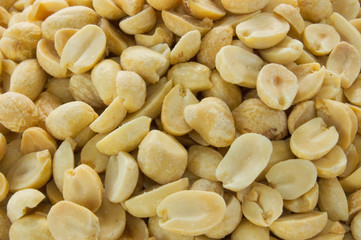 A macro shot of dry roasted peanuts