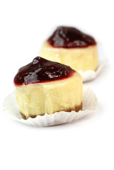 Cheesecake with fruit jam topping isolated