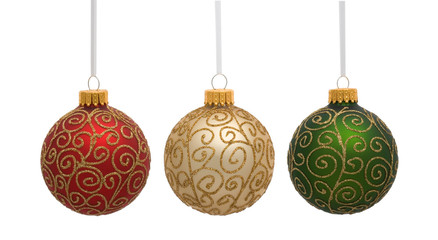 Red gold and green Christmas ornaments on white