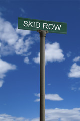 Skid row street sign with a cloudy sky background