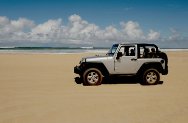 Fototapeta na wymiar Nice simple Image of a Vehicle on the sand In Kauai