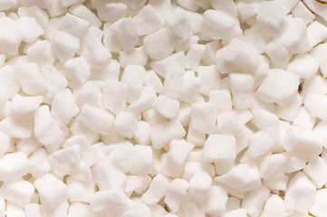 White sugar cubes arranged at the background