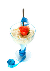 Cottage cheese in glass with cream and berries.