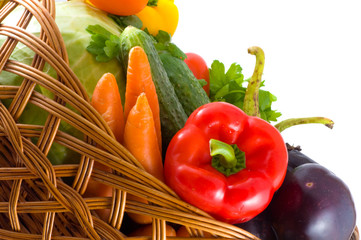Vegetables in basket. Isolation on the white