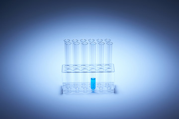 blue liquid in one of eight test tubes in glass container