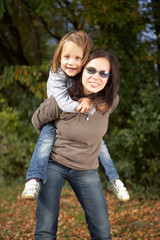 Fototapeta premium mother and daughter on a beautiful autumn day