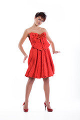 Young woman in fashionable dress and with stylish hairdressing