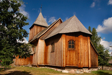 Wooden old styled church in polish countryside