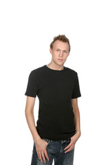 Fototapeta premium attractive young man in black with thumbs in pockets