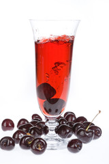 Glass of juice and cherries