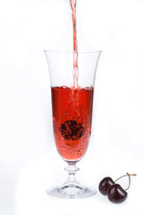 Glass of juice and cherries