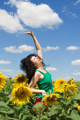 fun woman in the field of sunflowers