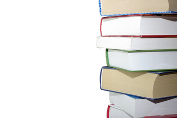 Stack of different books isolated on white background.