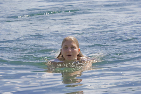 Young woman swimming, Canada
