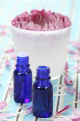 essential oil beautiful pink flower and aromatic candle