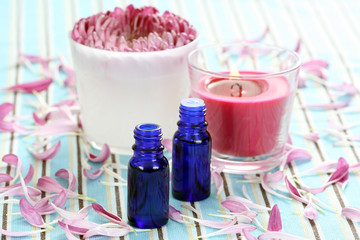 essential oil beautiful pink flower and aromatic candle