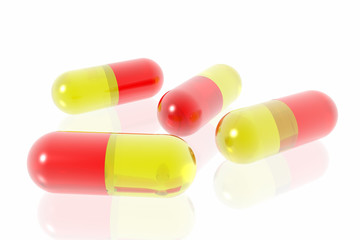 red and yellow pills on white background