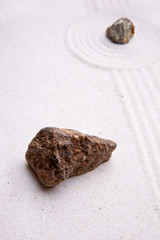 A rock in sand - zen rock garden