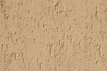 wall with yellow stucco background