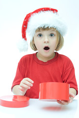 little Santa girl and Christmas gifts, on white