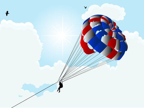 Parachute against the cloudy sky