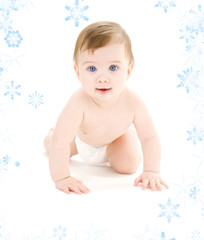 bright picture of crawling baby boy in diaper
