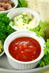 Vegetarian platter with tortillas, sour cream and tomato salsa