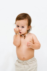 Cute and smiling topless toddler boy, isolated