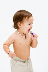 Cute topless toddler boy with open mouth singing, isolated
