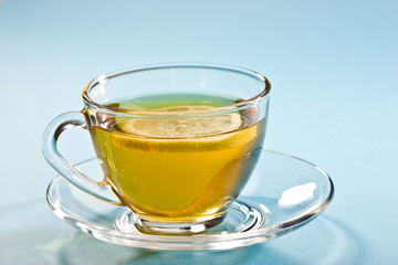 cup of tea with lemon over blue
