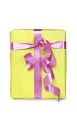 Gift box, reflected on white background. Shallow depth of field