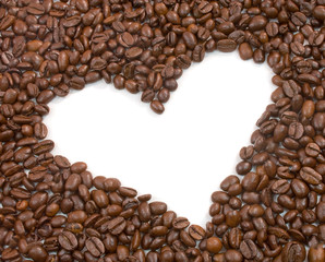 Heart shape surrounded by roasted coffee beans
