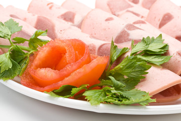 The sausage cut by slices on a dish