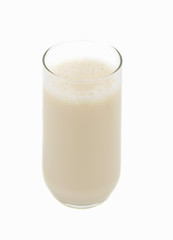 big glass of natural soy beverage, white background
