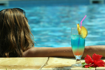 fresh cocktail standing by the swimming pool