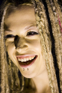 Laughing Woman with Face Piercings and Dread Lock Hair