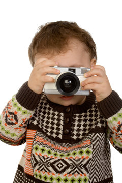little boy taking a photograph