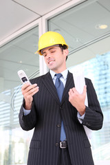 A handsome business construction man at office building