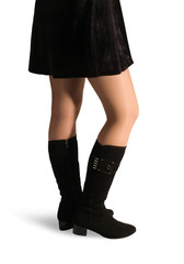 female legs in black high shoes.